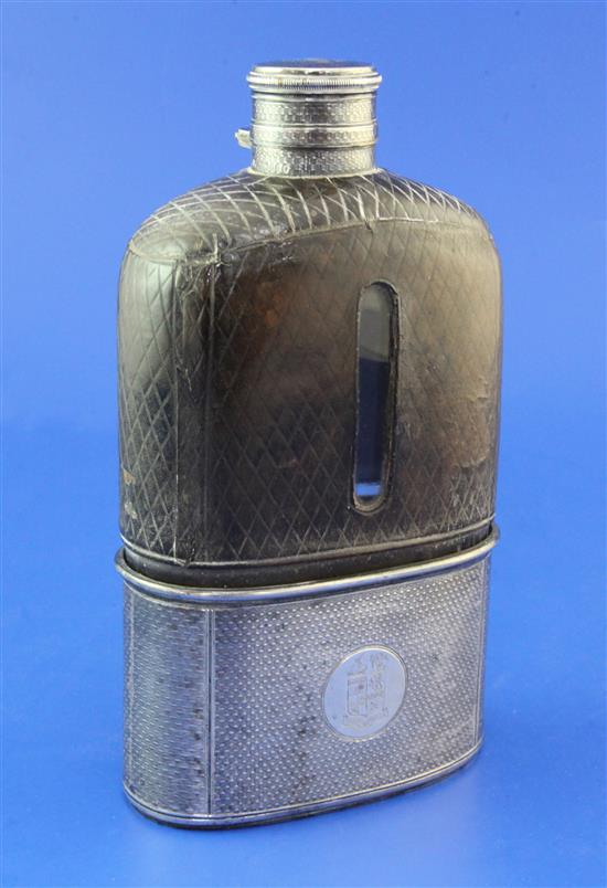 A large Victorian leather and engine turned silver mounted glass hip flask, 7.5in.